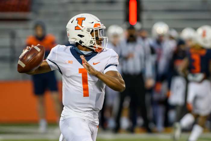 Illinois quarterback Isaiah Williams attempting a throw in Monday night's spring game at Memorial Stadium in Champaign, Ill.